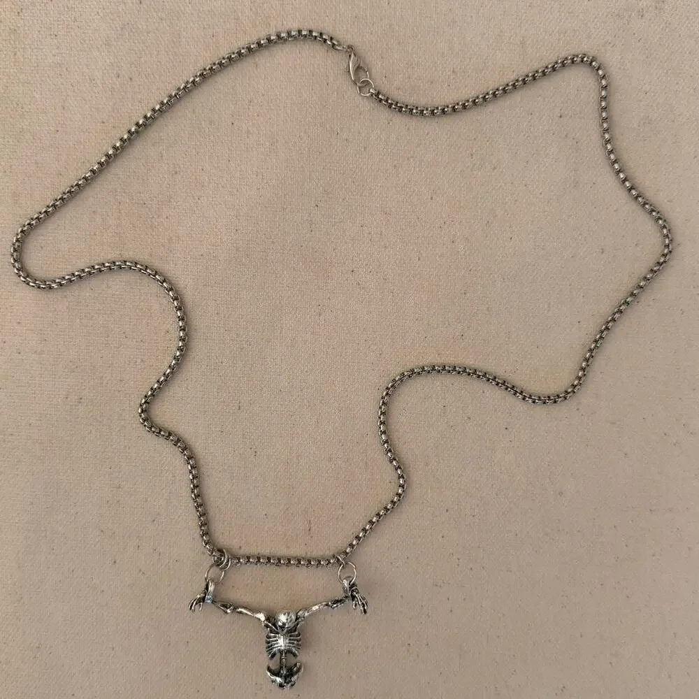 Silver skeleton necklace on a